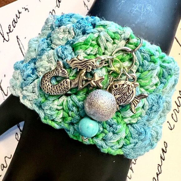 HAND CROCHETED CUFF EMBELLISHED WITH MERMAID & FISH CHARMS IN COLORS BLUE/GREEN - Picture 4 of 4
